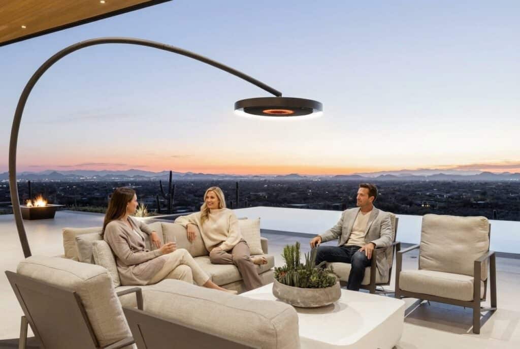 People gathered around a Bromic outdoor heater on a patio